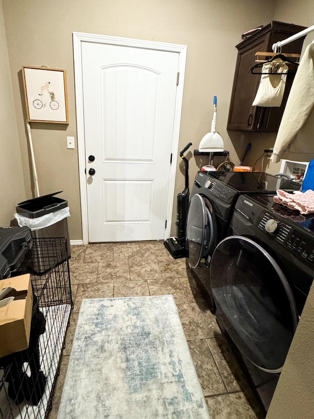 laundry area featuring cabinet space and independent washer and dryer