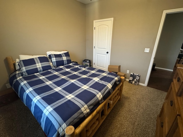 carpeted bedroom with baseboards