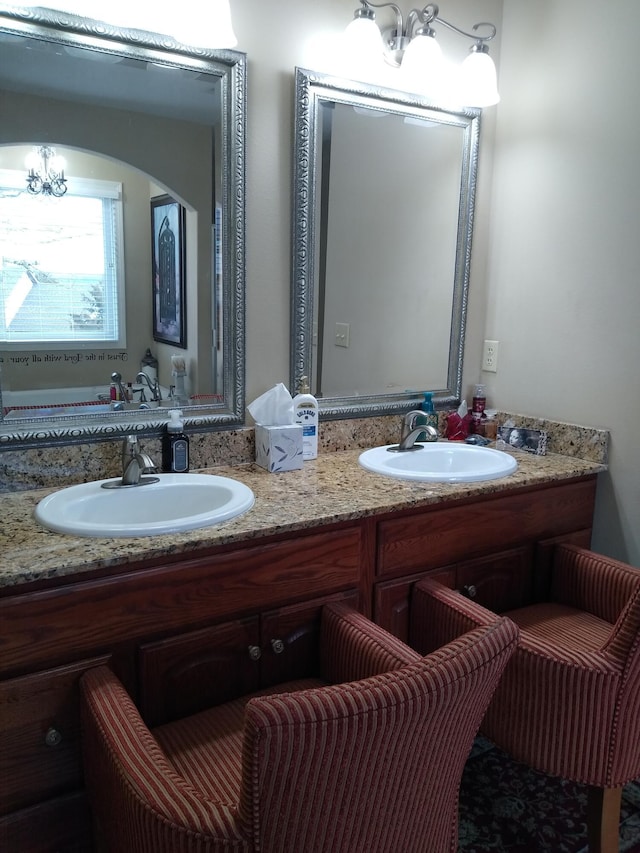 full bath featuring a sink and double vanity