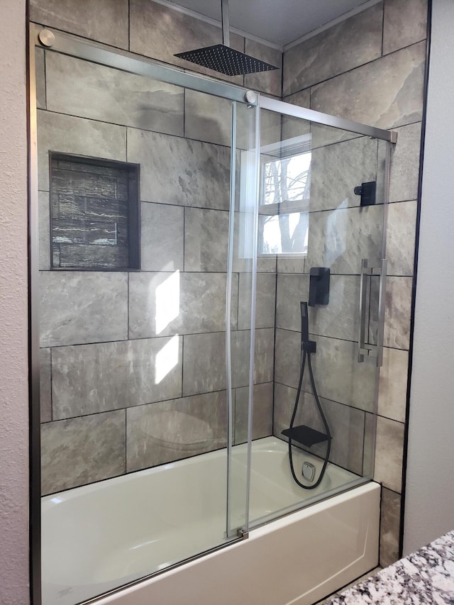 bathroom with a combined bath / shower with rainfall shower