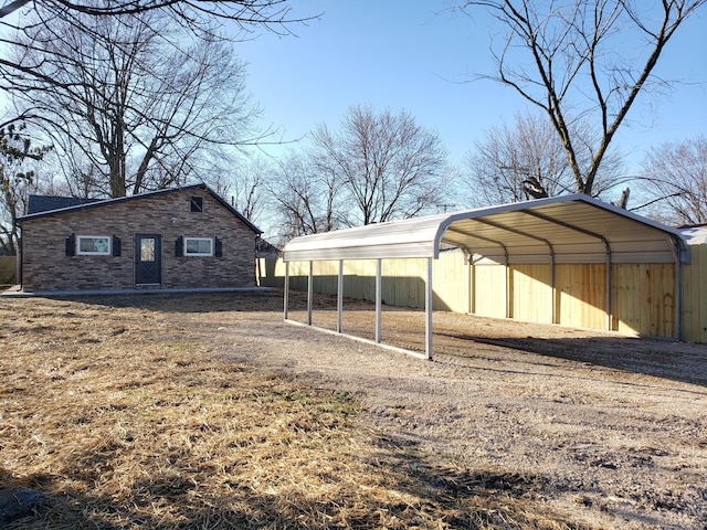 exterior space featuring a carport and driveway