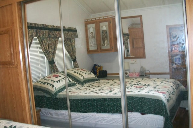 bedroom with ornamental molding