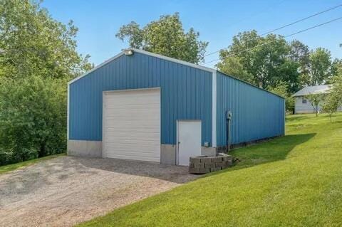 detached garage featuring driveway