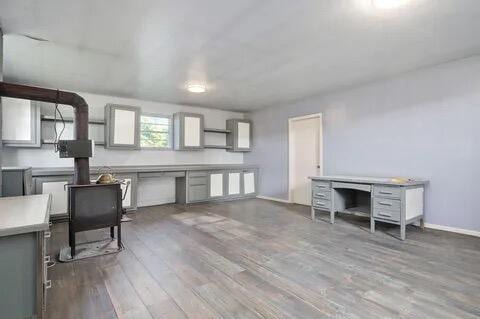 kitchen with wood finished floors and baseboards