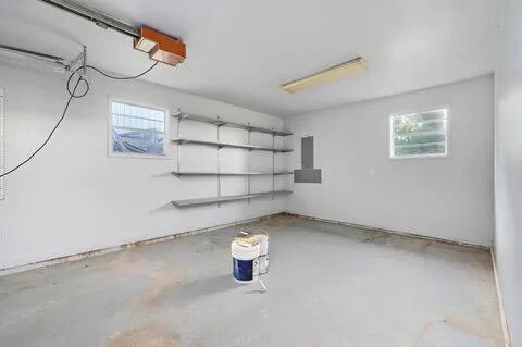 basement featuring a garage and a wealth of natural light