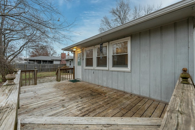 wooden terrace featuring fence