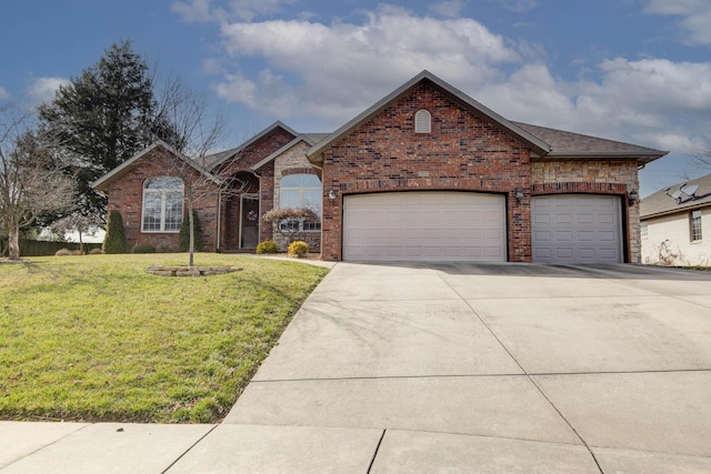 view of front of house with a front yard, concrete driveway, brick siding, and an attached garage