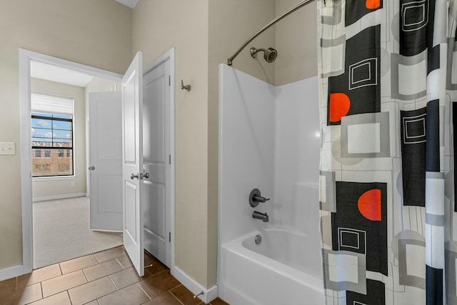 full bath featuring baseboards, shower / tub combo with curtain, and tile patterned floors