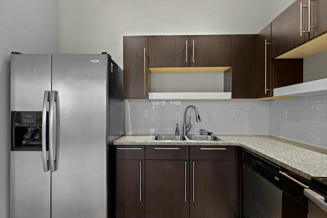 kitchen featuring stainless steel appliances, a sink, dark brown cabinetry, and open shelves