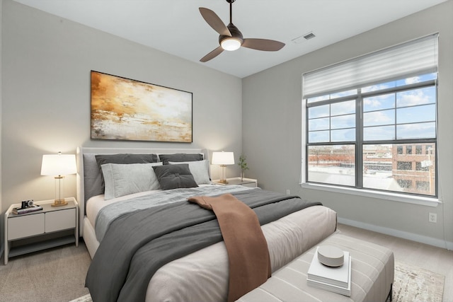 bedroom with ceiling fan, carpet, visible vents, and baseboards