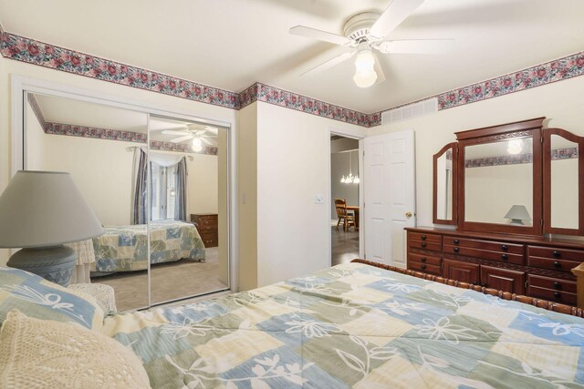 bedroom featuring ceiling fan, a closet, and visible vents