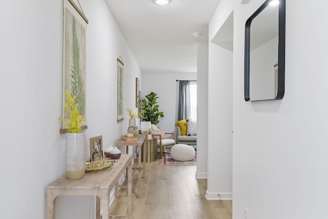 corridor featuring light wood-style floors