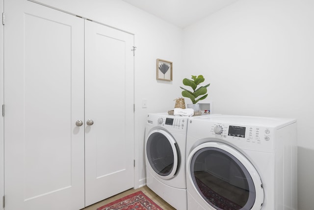 washroom with washer and dryer and laundry area