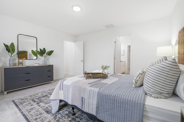 bedroom with baseboards, visible vents, and light colored carpet