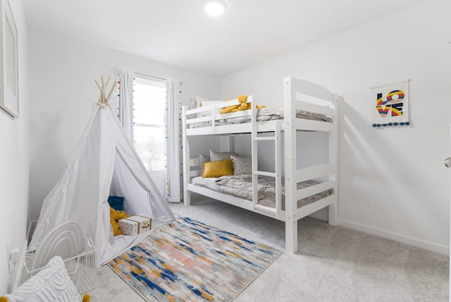 carpeted bedroom with baseboards