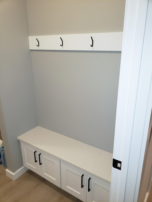 mudroom with light wood-type flooring and baseboards