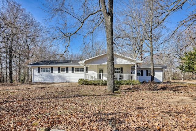 ranch-style house featuring a porch