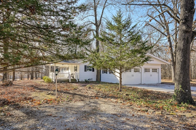 view of front of property featuring a porch and a garage