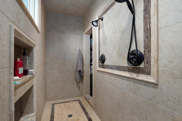 full bathroom with tiled shower