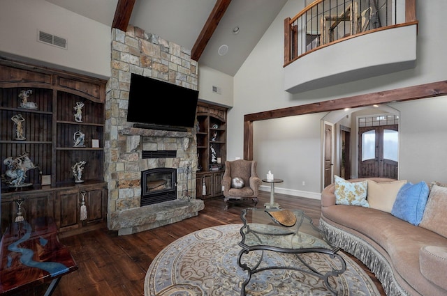 living room with visible vents, wood finished floors, french doors, and a stone fireplace