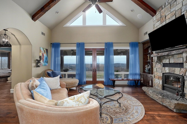 living room featuring high vaulted ceiling, a fireplace, visible vents, hardwood / wood-style floors, and beamed ceiling