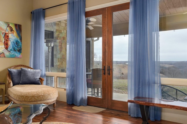 doorway with ceiling fan, french doors, and wood finished floors