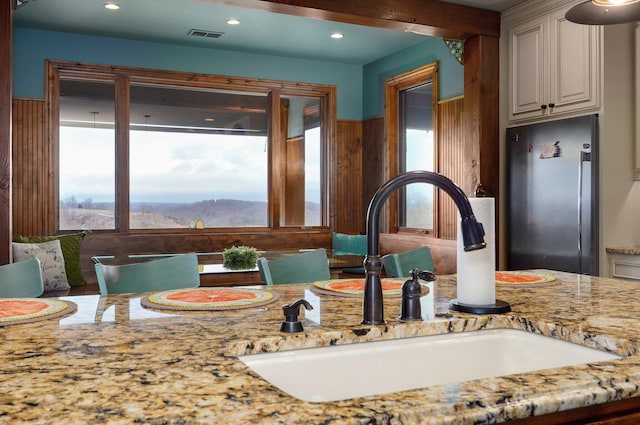 bathroom featuring plenty of natural light, visible vents, and recessed lighting