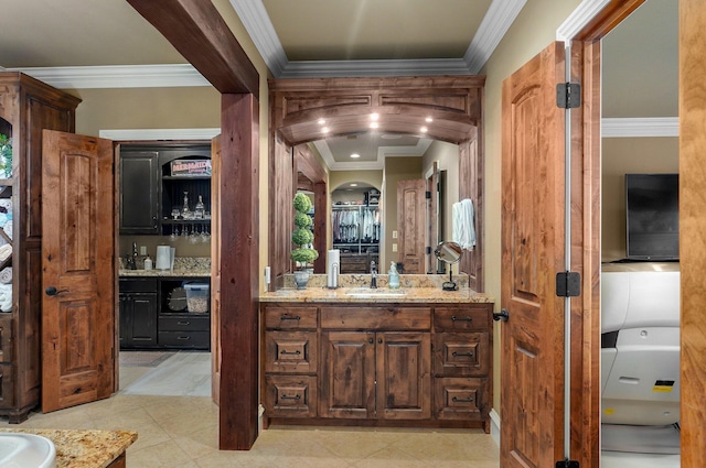 full bathroom with ornamental molding, tile patterned flooring, and vanity