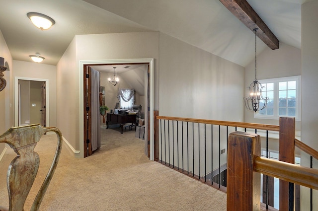 hallway with lofted ceiling with beams, a notable chandelier, carpet floors, an upstairs landing, and baseboards