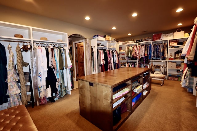 walk in closet featuring carpet