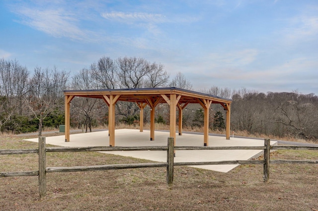 view of community with fence and a gazebo