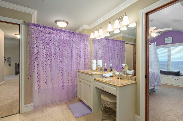 ensuite bathroom with ensuite bathroom, ornamental molding, ceiling fan, vanity, and tile patterned floors