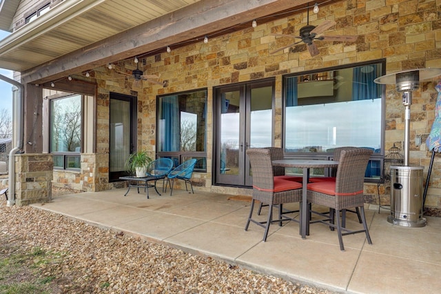 view of patio / terrace with ceiling fan and outdoor dining area