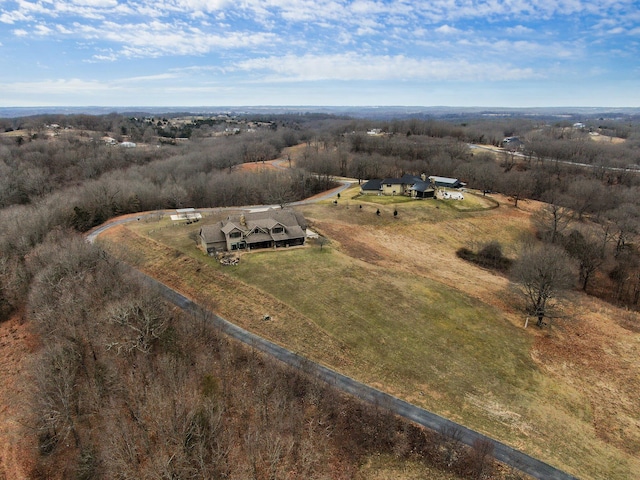 birds eye view of property with a rural view