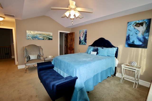 carpeted bedroom featuring lofted ceiling, baseboards, visible vents, and a ceiling fan