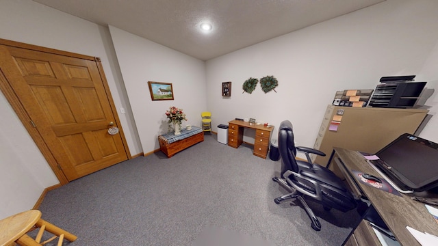 carpeted home office featuring lofted ceiling and baseboards