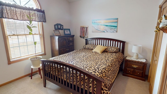 carpeted bedroom featuring visible vents and baseboards