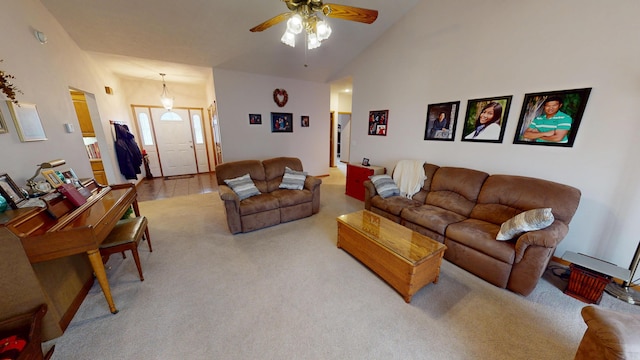 living area featuring light carpet, high vaulted ceiling, and a ceiling fan