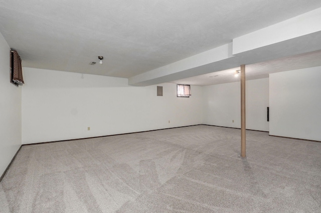 below grade area featuring carpet flooring