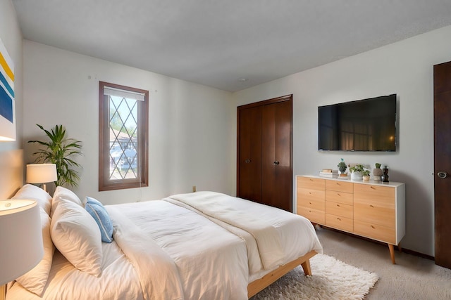 bedroom with light colored carpet