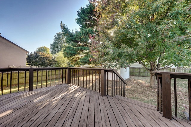 deck with a fenced backyard