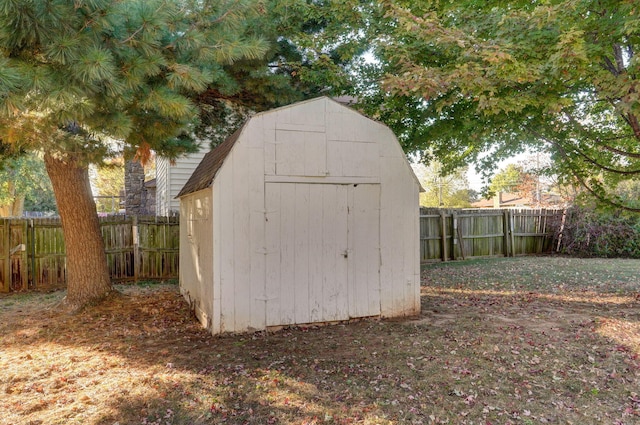 view of shed with a fenced backyard