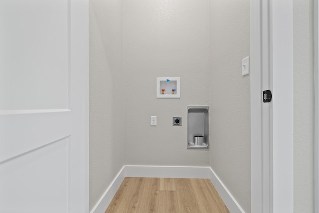 laundry area with washer hookup, hookup for an electric dryer, light wood-style flooring, and baseboards