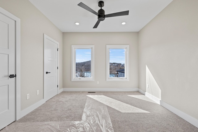 interior space with baseboards, visible vents, carpet flooring, and recessed lighting