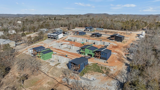 bird's eye view featuring a wooded view