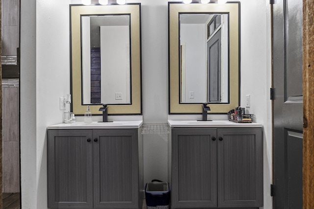 bathroom with two vanities and a sink