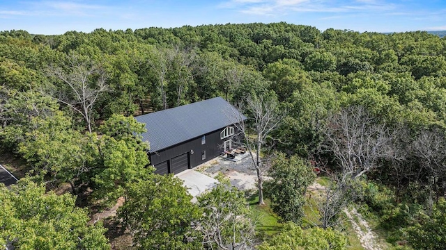 birds eye view of property with a forest view