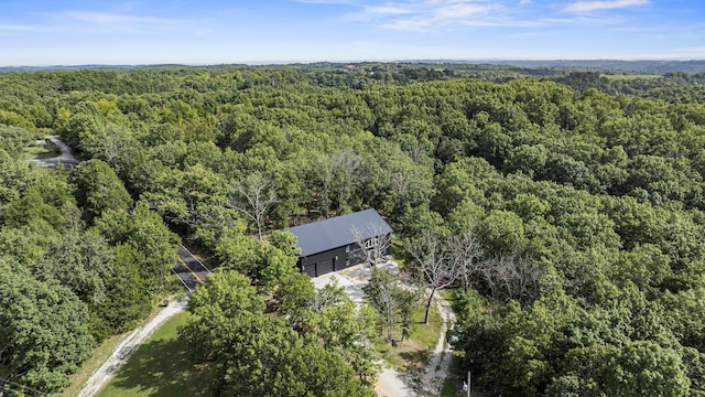 aerial view featuring a view of trees