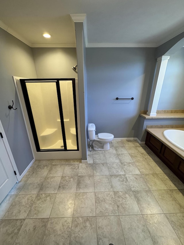 bathroom with a garden tub, a shower stall, and crown molding