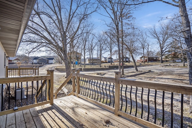 wooden terrace with a residential view